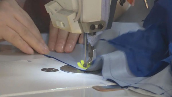 新邦服饰:开足马力赶生产 全年订单充足