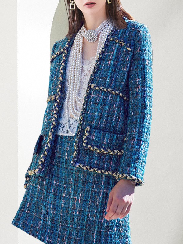 漫逸春色2022秋冬季蓝色短裙