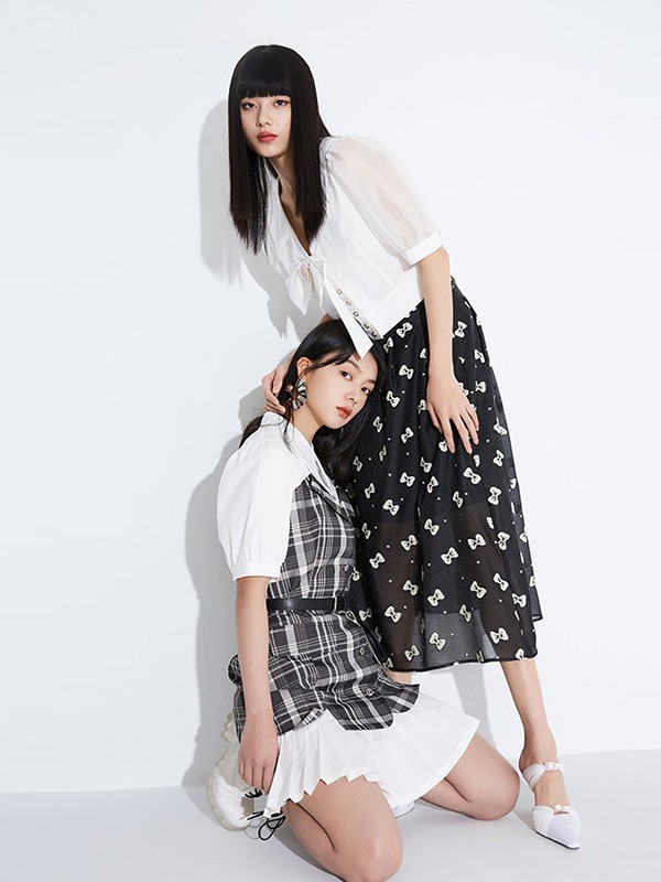 杰茜莱女装2023春夏季黑色半身裙